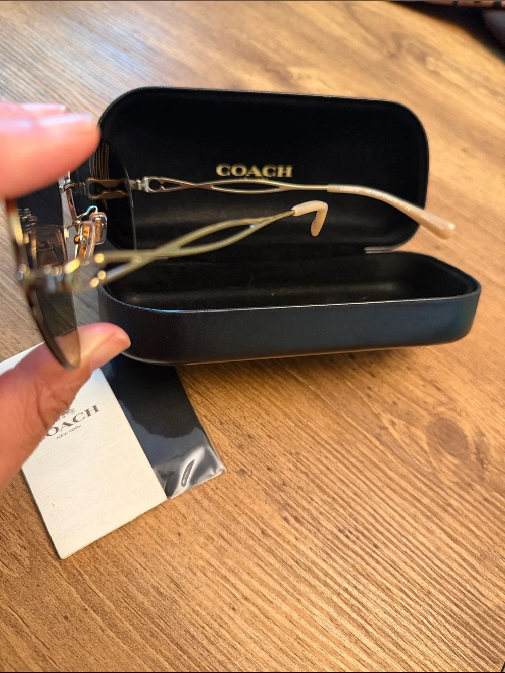 COACH Women’s Black and Gold Aviator Sunglasses